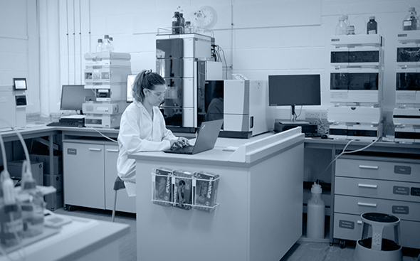 Analytical Science at CatSci 3 Analytical Science - blue toned image of female scientist in Analytical Science laboratory