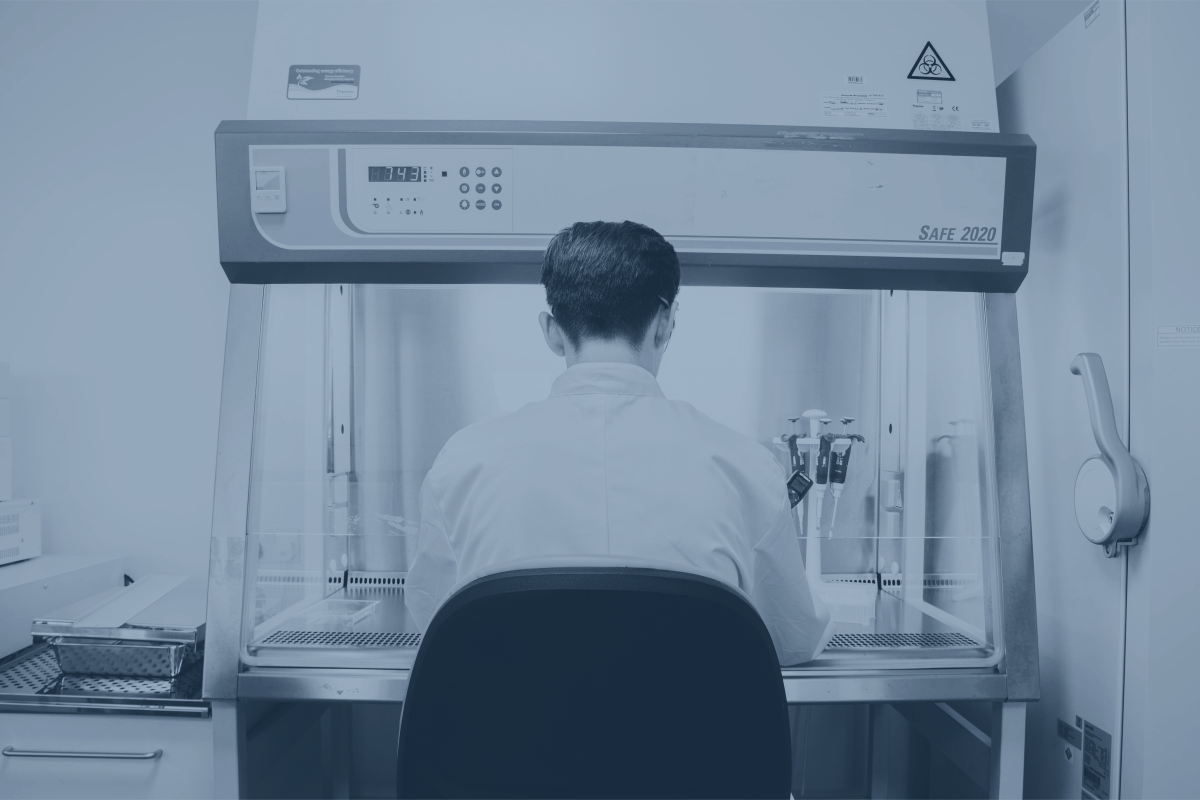 CatSci Bioscience Service CatSci Bioscience Service: blue-toned image of male scientist in front of a glovebox in a lab