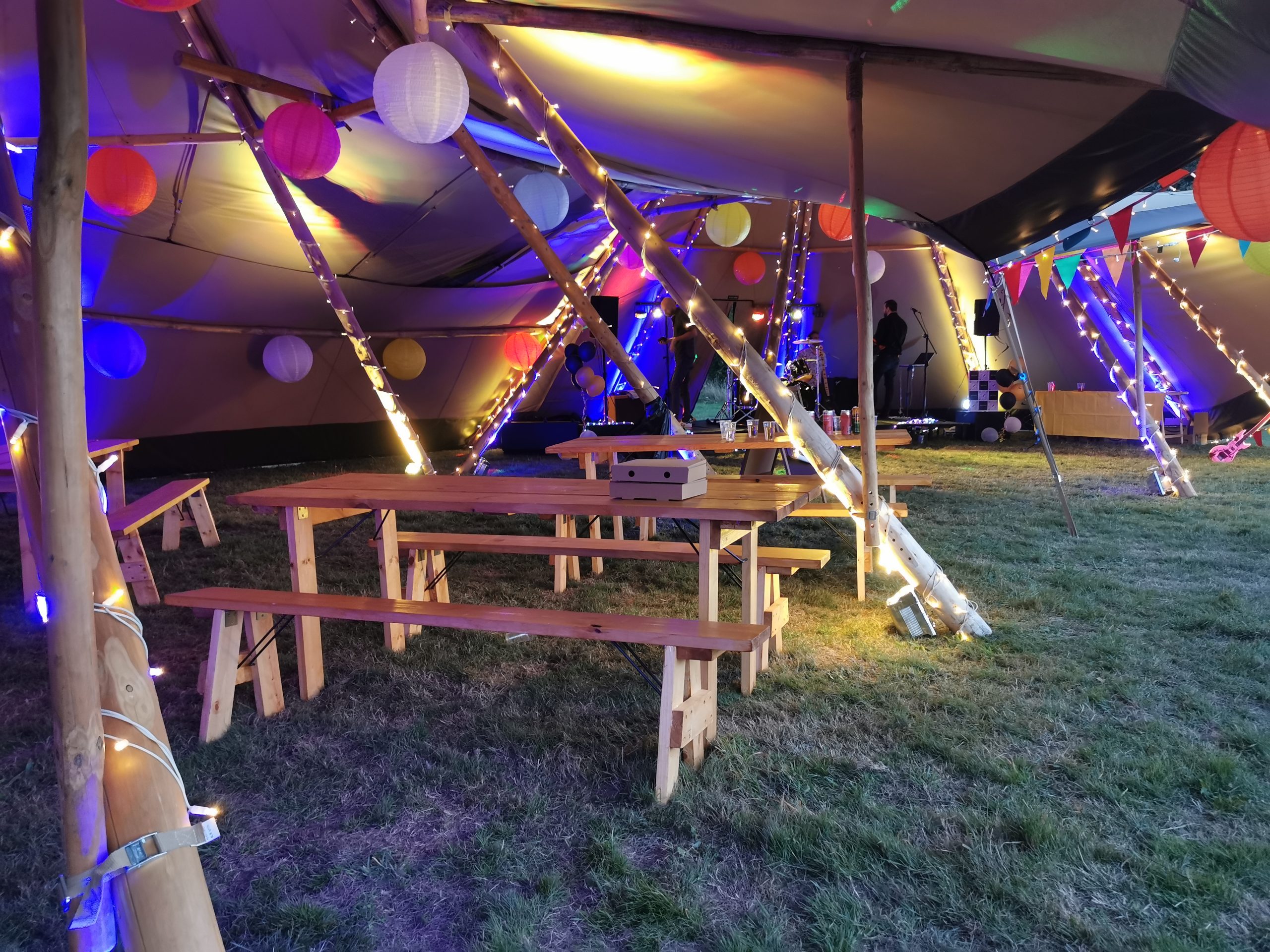CatSci Enjoy CatFest: Image inside tents with benches, fairy lights, balloons and flags