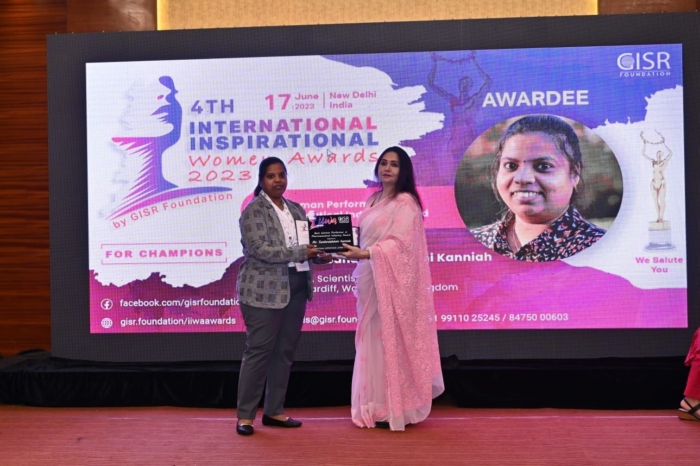 Lakshmi Best Woman Performer in Pharmaceutical Industry: Image of Lakshmi Kanniah on stage receiving her award