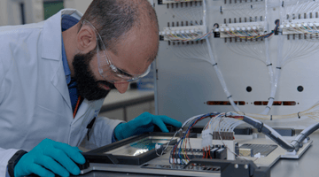 Hybrid Modality Development Services - image of male scientist working in an oligonucleotide laboratory