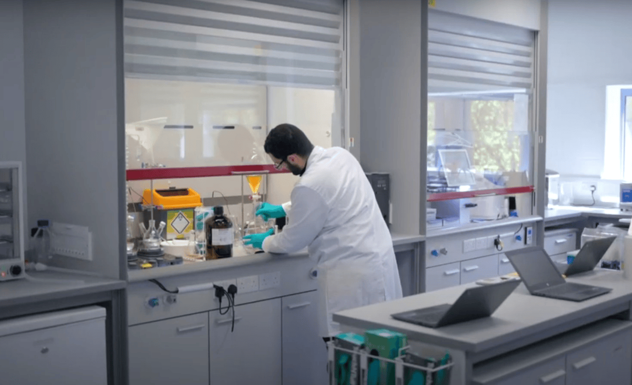 image of male scientist working at a glovebox